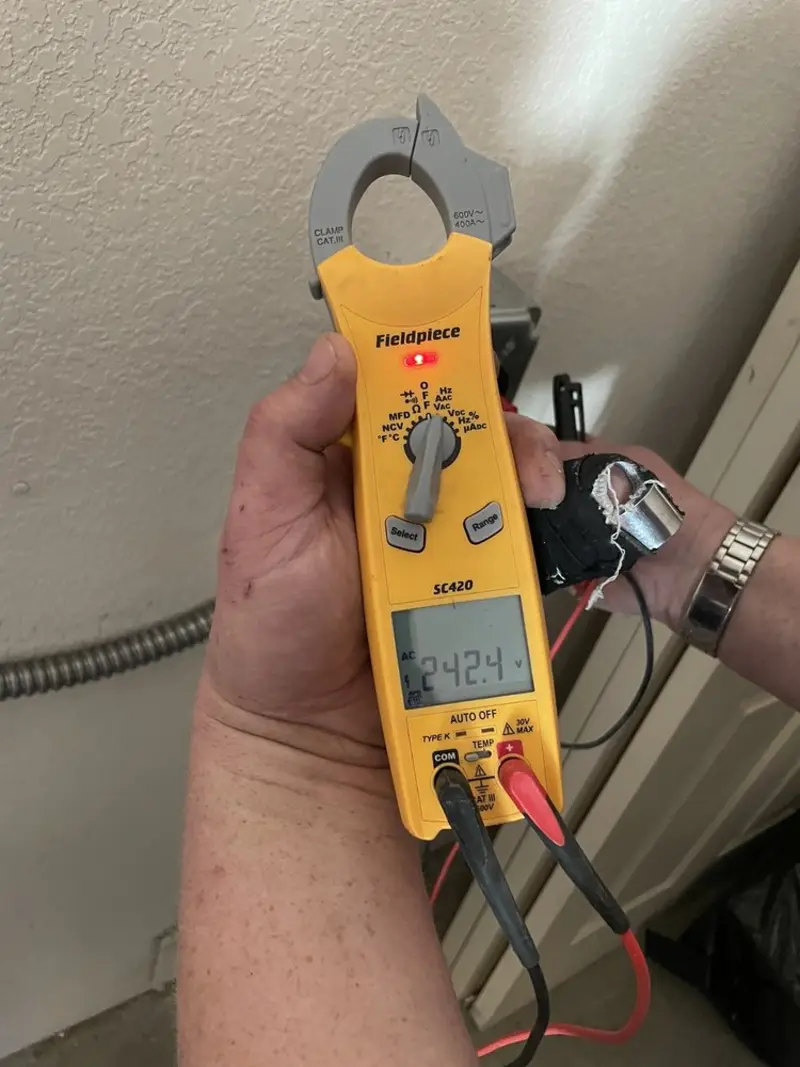 Voltage testing with clamp meter during Generator Installation in Ionia